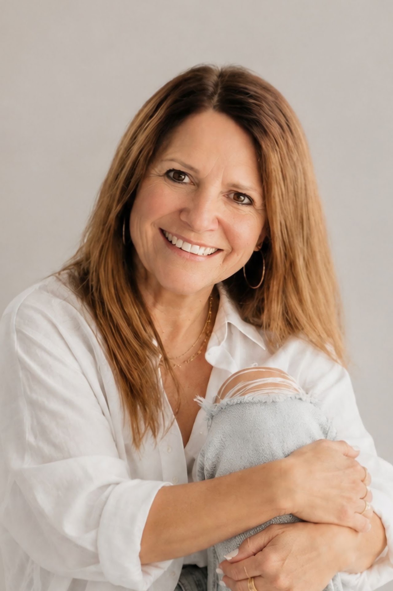 a lady sitting and smiling